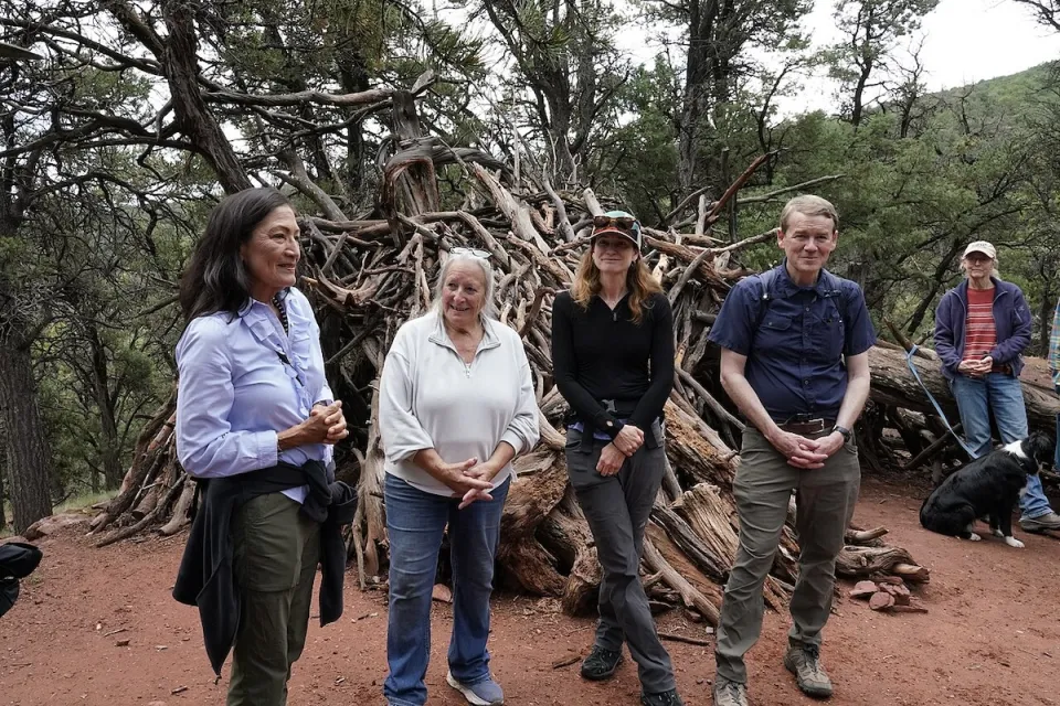 Interior Secretary Deb Haaland standing in a forested area in Colorado to celebrate recent action by the Biden-Harris administration to withdraw around 220,000 acres in the Thompson Divide area for mineral leasing on 1 July 2024.